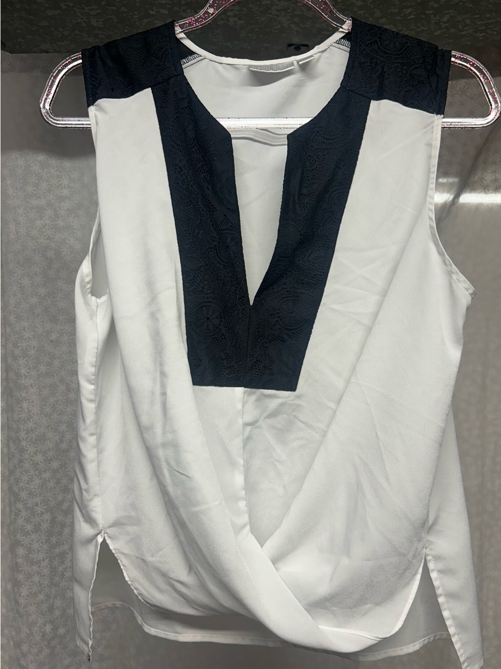 Sleeveless White Top with black lace V-Neck Accent